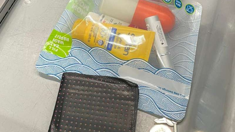 hand luggage items going through airline security checks including liquids in a Nom Nom Kids reusable Sandwich bag