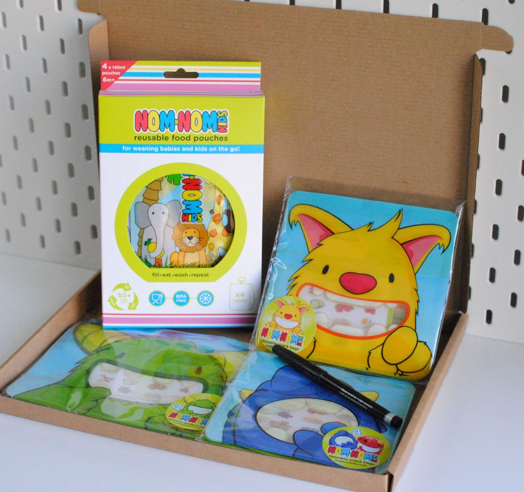 a gift box bundle containing reusable pouches, snack bags and reusable sandwich bags