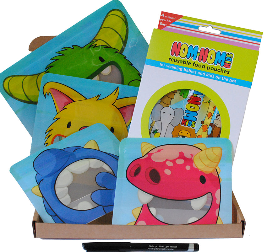 A set of reusable food pouches and snack bags with colorful monster designs, accompanied by a pen for labeling, displayed in a cardboard box.