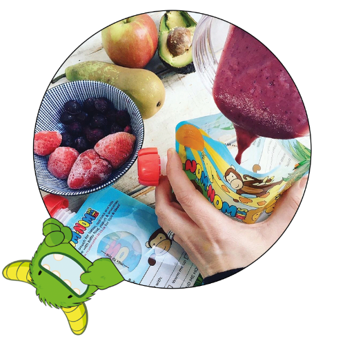 homemade smoothie being poured into a Nom Nom kids reusable yogurt pouch
