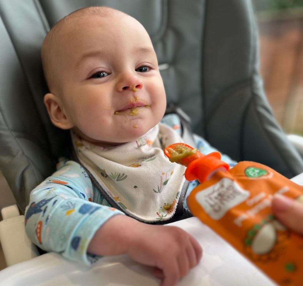 baby feeding from the Little Nom Nom Pouch spoon