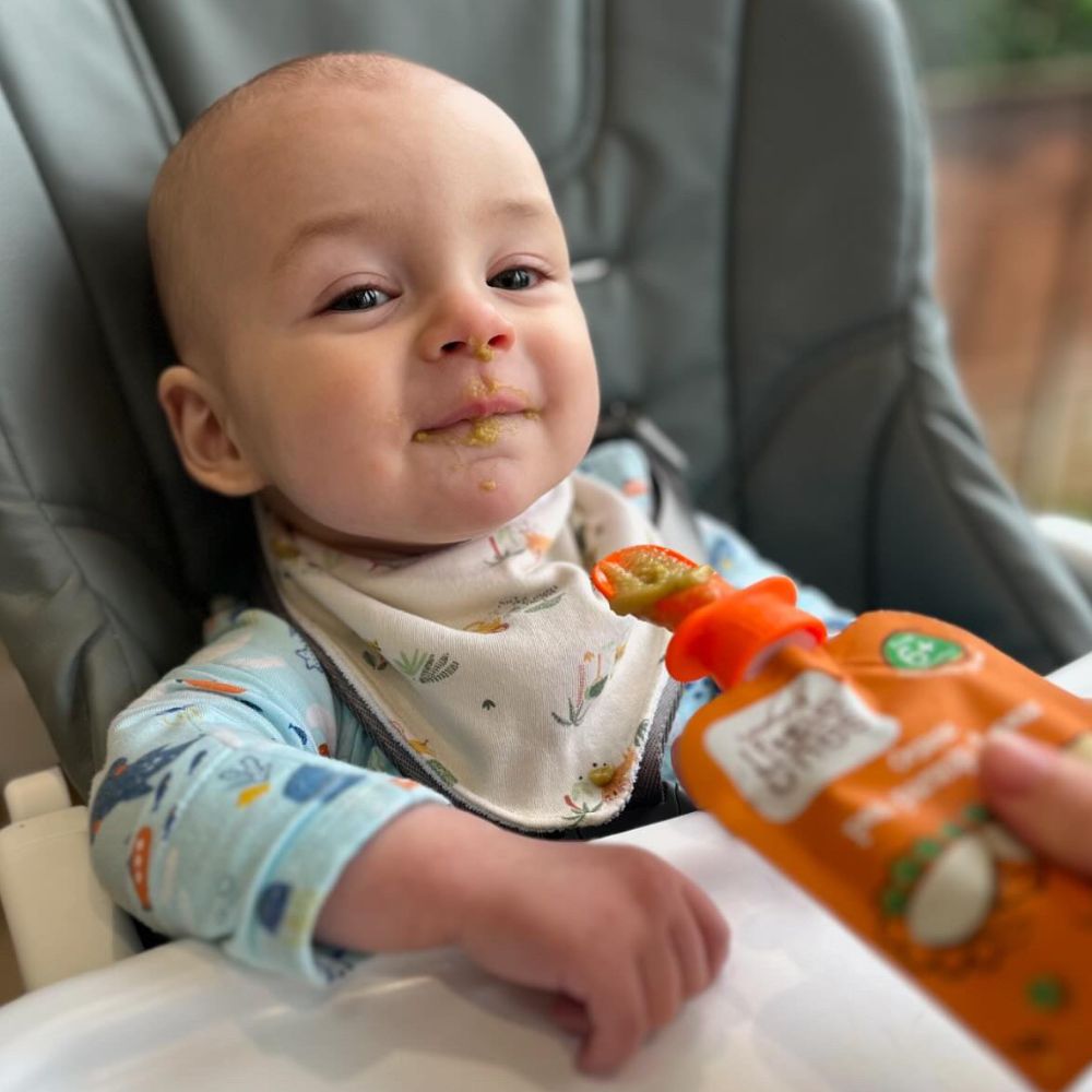 baby feeding from the Little Nom Nom Pouch spoon