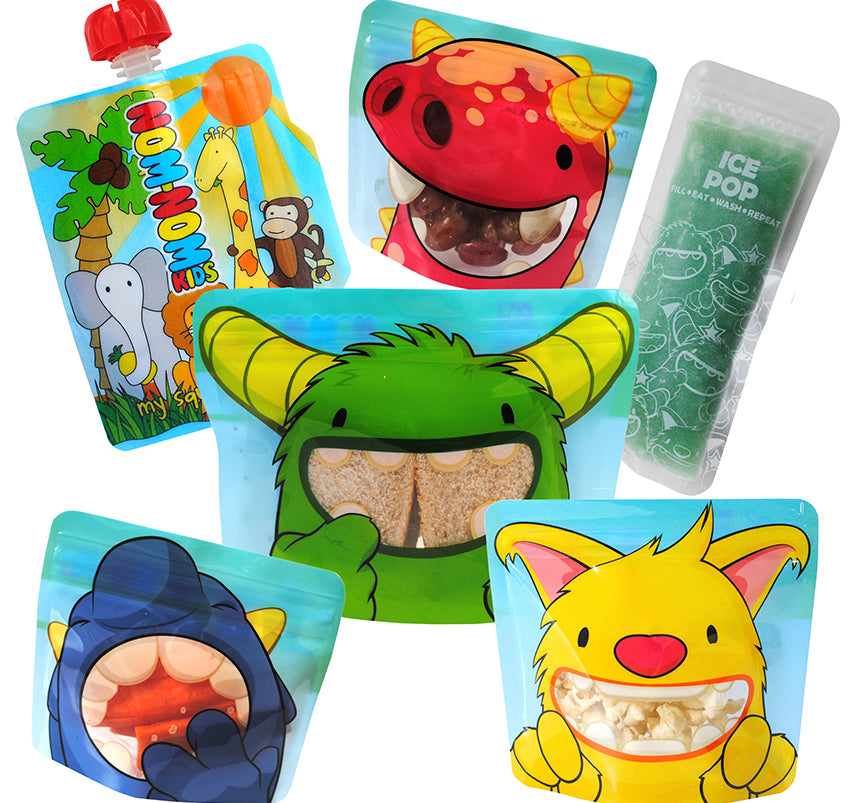 A collection of colourful reusable food pouches and snack bags with cartoon animal designs filled with sandwiches and healthy snacks