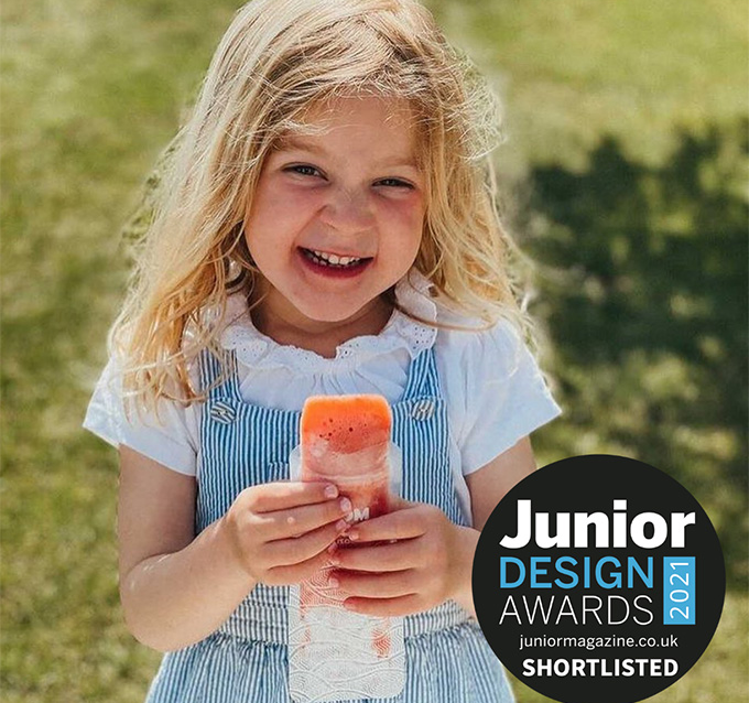 child eating an ice pop from a Nom Nom kids reusable ice pop bag