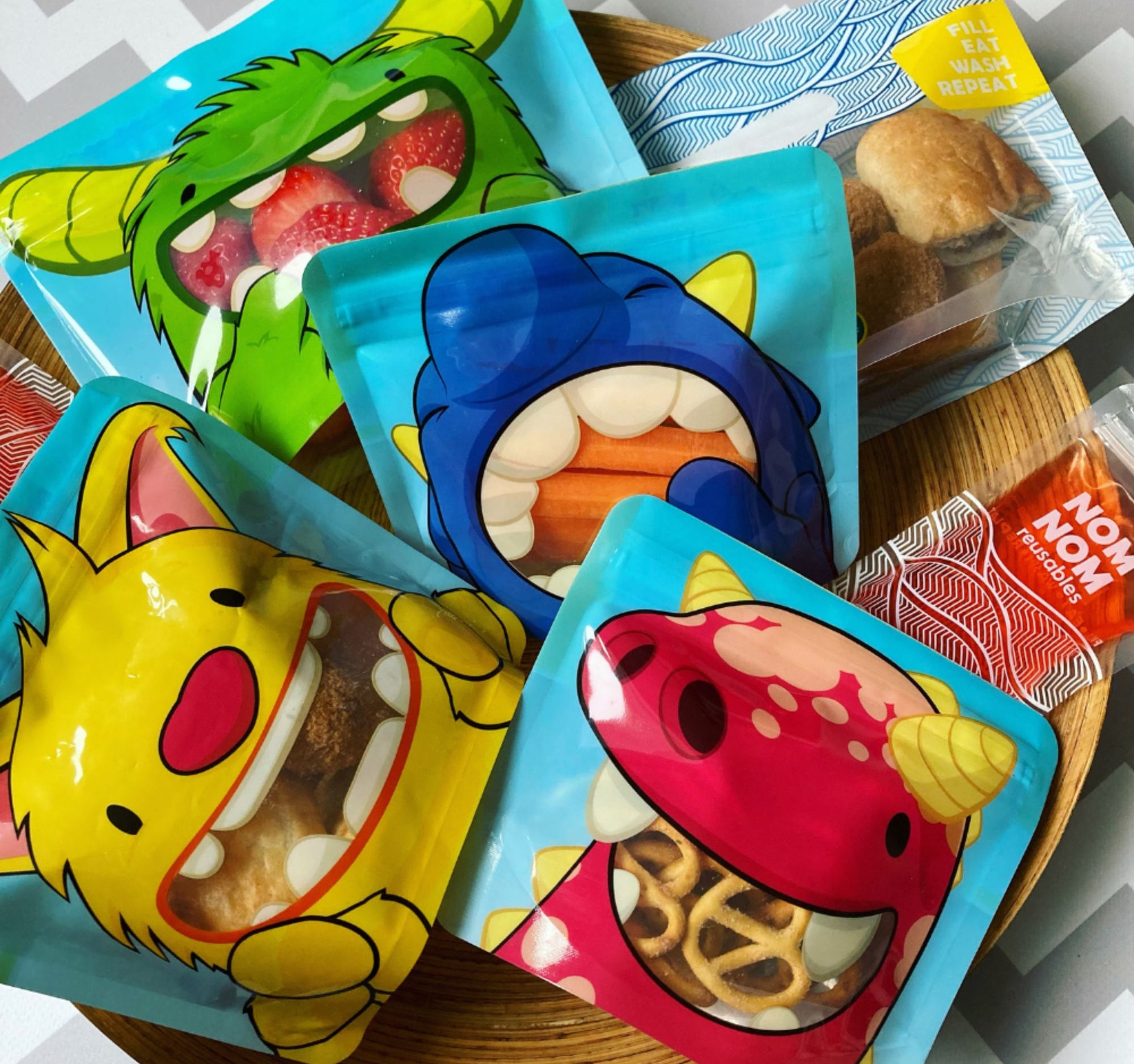 Nom Nom kids reusable snack monster pouches filled with various snacks