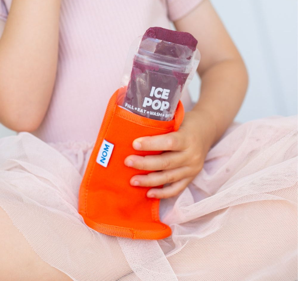 Orange Neoprene ice pop sleeve for a Nom Nom reusable ice pop bag to stop hands from getting col and keep the ice pop from melting so quick