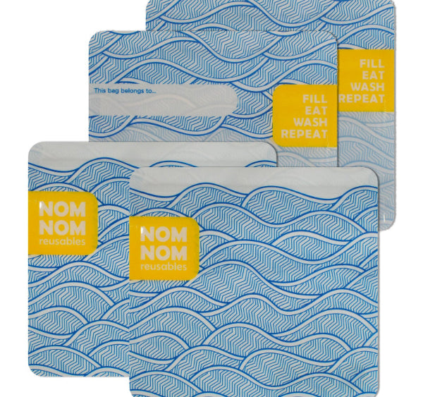reusable snack bags with blue wave pattern and yellow 'Nom Nom' labels on a white background