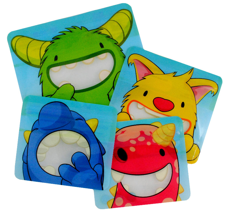 A set of four reusable snack bags with cartoon monster designs in green, yellow, blue, and red Nom Nom kids.