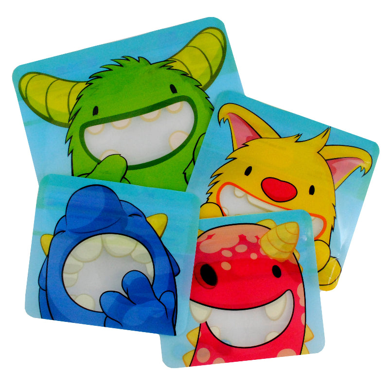 A set of four reusable snack bags with cartoon monster designs in green, yellow, blue, and red Nom Nom kids.