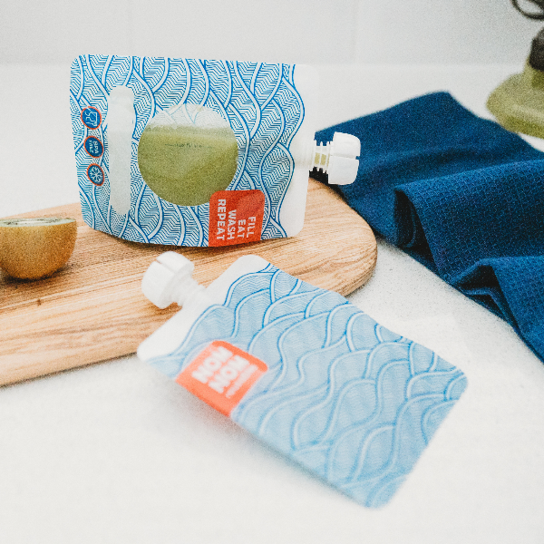 nom nom smoothie pouch filled with green smoothie