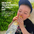 Child eating from a nom nom kids reusable ice pop bag with text about healthy treats