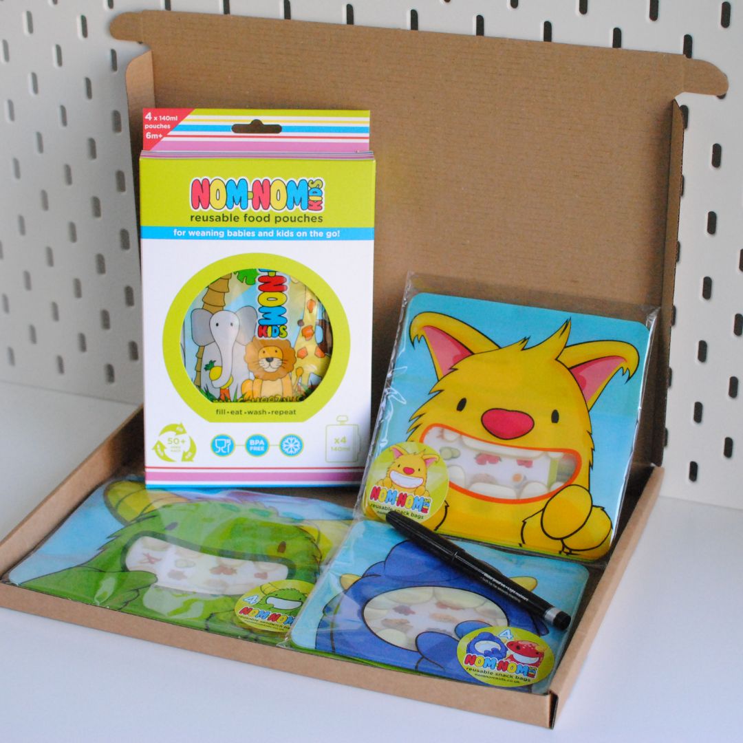 a gift box bundle containing reusable pouches, snack bags and reusable sandwich bags
