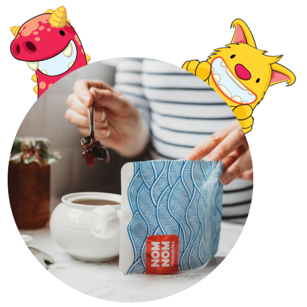 Person holding a reusable pouch with the grown up wave design and adding some jam to her yogurt