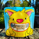 Nom Nom kids reusable snack pouch with flapjack inside 