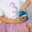 child eating from Nom Nom kids reusable snack bag