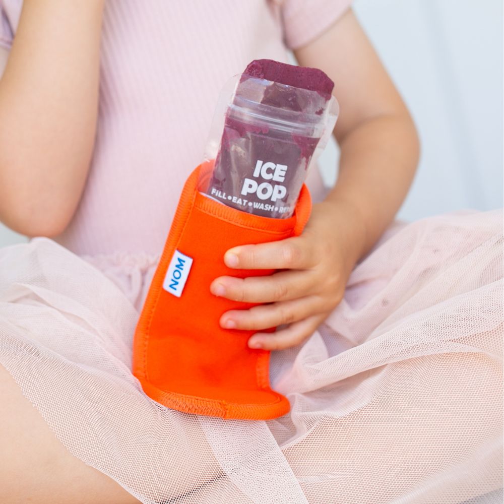 Orange Neoprene ice pop sleeve for a Nom Nom reusable ice pop bag to stop hands from getting col and keep the ice pop from melting so quick