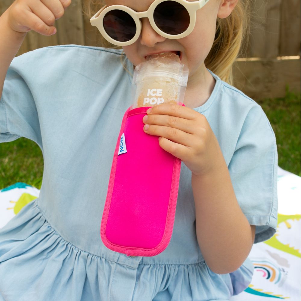 Bright pink Neoprene ice pop sleeve for a Nom Nom reusable ice pop bag to stop hands from getting col and keep the ice pop from melting so quick