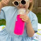 Bright pink Neoprene ice pop sleeve for a Nom Nom reusable ice pop bag to stop hands from getting col and keep the ice pop from melting so quick
