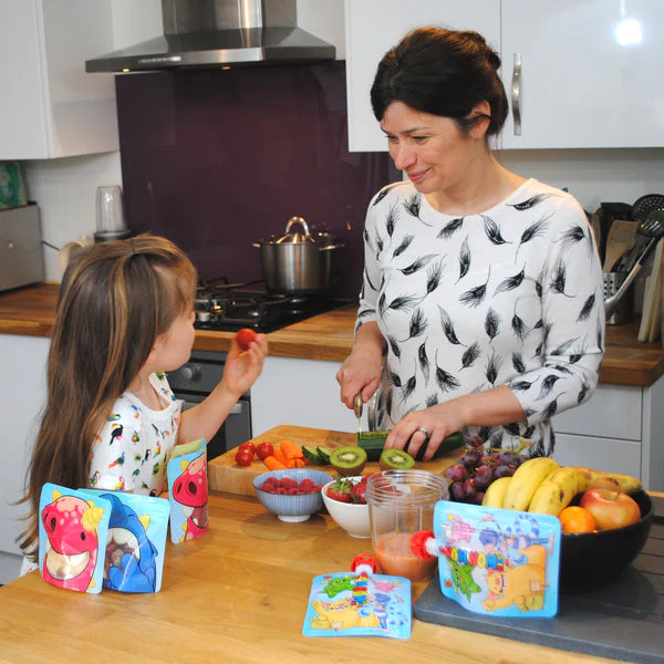 Nom Nom kids reusable pouches being used 