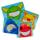 A set of four reusable snack bags with cartoon monster designs in green, yellow, blue, and red Nom Nom kids. 