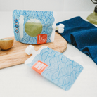 nom nom smoothie pouch filled with green smoothie